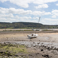 Buy canvas prints of Boats moored in Red Wharf BayAnglesey at low tide. by Kevin Hellon