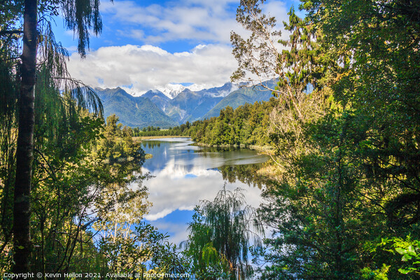 View over Lake Matheson with Mount Cook in the bac Picture Board by Kevin Hellon