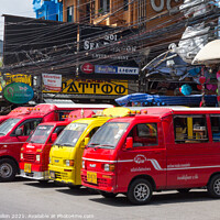 Buy canvas prints of Tuk tuks lined up waiting for business in Bangla road, Patong be by Kevin Hellon