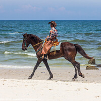 Buy canvas prints of Horse and rider, Hua Hin beach, Thailand by Kevin Hellon