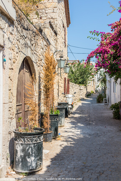 Narrow street with stone houses Picture Board by Kevin Hellon