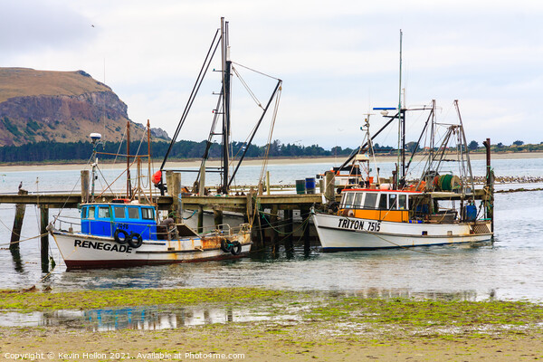  Fishing boats moored at a pier Picture Board by Kevin Hellon