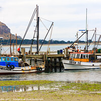 Buy canvas prints of  Fishing boats moored at a pier by Kevin Hellon