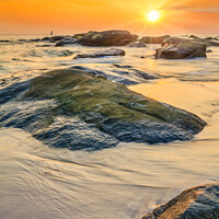 Buy canvas prints of Sunrise over the rocks by Kevin Hellon