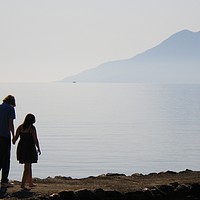 Buy canvas prints of Couple by the Aegean by Mike Lanning