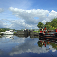Buy canvas prints of Reflections of Crinan Harbour by David Wilson
