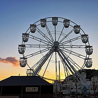 Buy canvas prints of Ferris wheel at sunset by Lee Sulsh