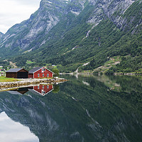 Buy canvas prints of red wooden house at norway fjord by Chris Willemsen