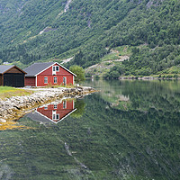 Buy canvas prints of red wooden house at norway fjord by Chris Willemsen