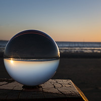 Buy canvas prints of sunset on the beach captured in glass crystal sphe by Chris Willemsen