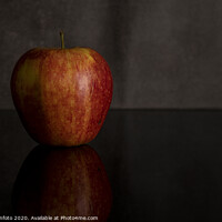 Buy canvas prints of One red apple isolated on black by Chris Willemsen