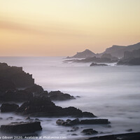Buy canvas prints of Beautiful long exposure landscape image of sea over rocks during vibrant sunset by Matthew Gibson
