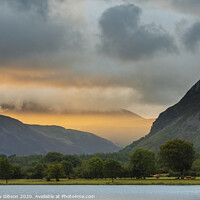 Buy canvas prints of Stunning epic sunrise landscape image looking along Loweswater towards wonderful light on Grasmoor and Mellbreak mountains in Lkae District by Matthew Gibson