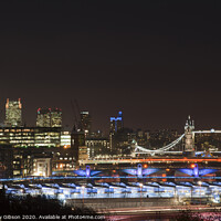 Buy canvas prints of Beautiful landscape image of the London skyline at night looking along the River Thames by Matthew Gibson