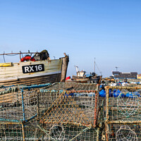 Buy canvas prints of Old Fishing boats and equipment on Hastings beach landscape at dawn by Matthew Gibson
