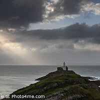 Buy canvas prints of Landscape panorama of Mumbles lighthouse in Wales with sunbeams over sea by Matthew Gibson