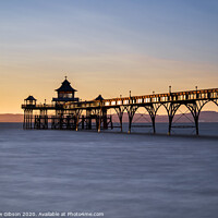 Buy canvas prints of Beautiful long exposure sunset over ocean with pier silhouette by Matthew Gibson