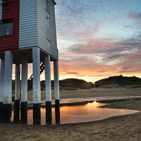 Buy canvas prints of Beautiful landscape sunrise stilt lighthouse on beach by Matthew Gibson