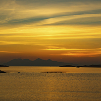 Buy canvas prints of Sunset over the Island of Eigg by Hugh McKean
