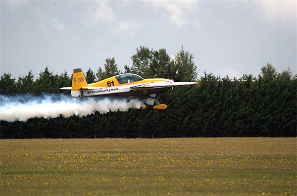 Extra 300 aerobatic plane taking off Picture Board by Chris Day