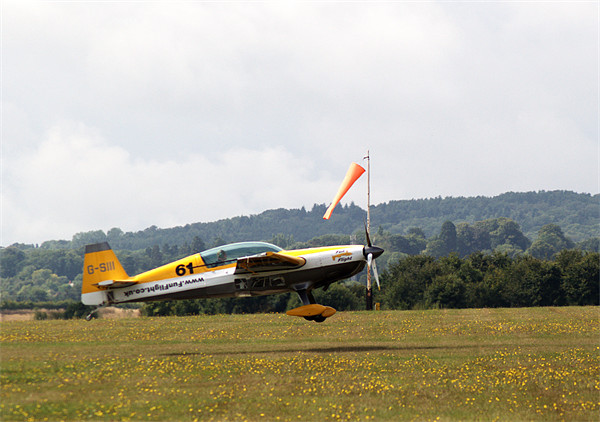 Extra 300 aerobatic plane lnding Picture Board by Chris Day