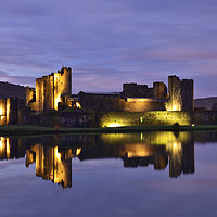 Buy canvas prints of Caerphilly Castle Floodlit Reflection. by Philip Veale