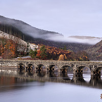 Buy canvas prints of Enthralling Dawn at Elan Valley's Dam by Philip Veale