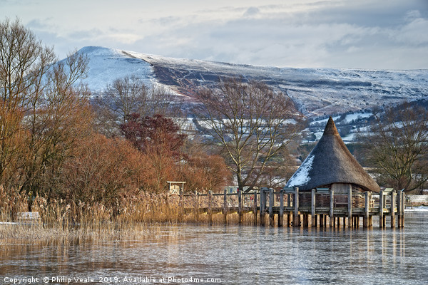 Llangorse Lake Crannog and Mynydd Troed in Winter. Picture Board by Philip Veale