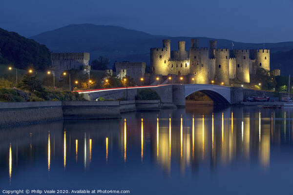 Conwy Castle Illuminated at Twilight. Picture Board by Philip Veale