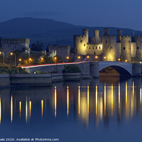 Buy canvas prints of Conwy Castle Illuminated at Twilight. by Philip Veale