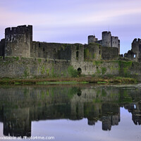 Buy canvas prints of Caerphilly Castle's Mirrored Beauty at Dawn. by Philip Veale