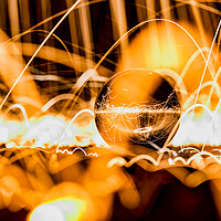 Buy canvas prints of Glass Ball showered with sparks (Wire Wool) by Shafiq Khan
