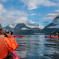 Buy canvas prints of Kayaking on Milford Sound between the Mountains in by Chantal Cooper