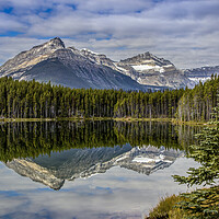 Buy canvas prints of Mountain reflections in lake by Chantal Cooper