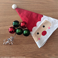 Buy canvas prints of  Christmas decorations Santa Hat - theme image. by Geoff Childs