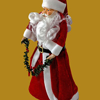 Buy canvas prints of Xmas Theme image of a brightly coloured full length Santa Clause by Geoff Childs