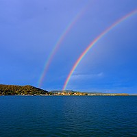 Buy canvas prints of  Double Rainbow in blue sky. by Geoff Childs