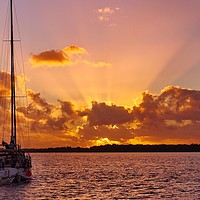 Buy canvas prints of Sunrise rays boat and sea. by Geoff Childs