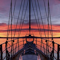 Buy canvas prints of Nautical Crimson  Sunrise with Boat  by Geoff Childs