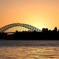 Buy canvas prints of Sydney Harbour Bridge sunset sillhouette. by Geoff Childs