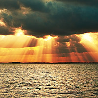 Buy canvas prints of Magnificent golden sun rays. by Geoff Childs