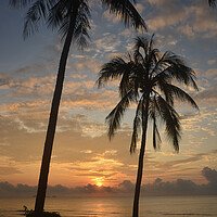 Buy canvas prints of Tropical sunrise seascape with Palm trees at Huay Yang , Thailand. by Geoff Childs
