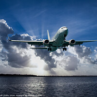 Buy canvas prints of Jet Airliner Flying in subeams by Geoff Childs