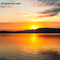 Buy canvas prints of Orange sunrise waterscape reflections panorama. by Geoff Childs