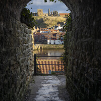 Buy canvas prints of Whitby through the alleyway arch. by Chris North