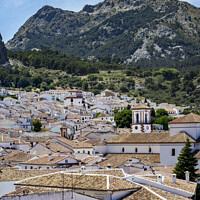 Buy canvas prints of  Grazalema Village and mountains. by Chris North