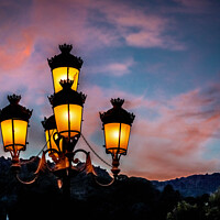 Buy canvas prints of Spanish street lights at dusk. by Chris North