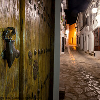 Buy canvas prints of Night time back street scene in Grazalema, Spain by Chris North