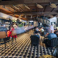 Buy canvas prints of The long bar at Raffles Hotel, Singapore. by Chris North
