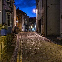 Buy canvas prints of The  cobbled streets of Staithes.  by Chris North